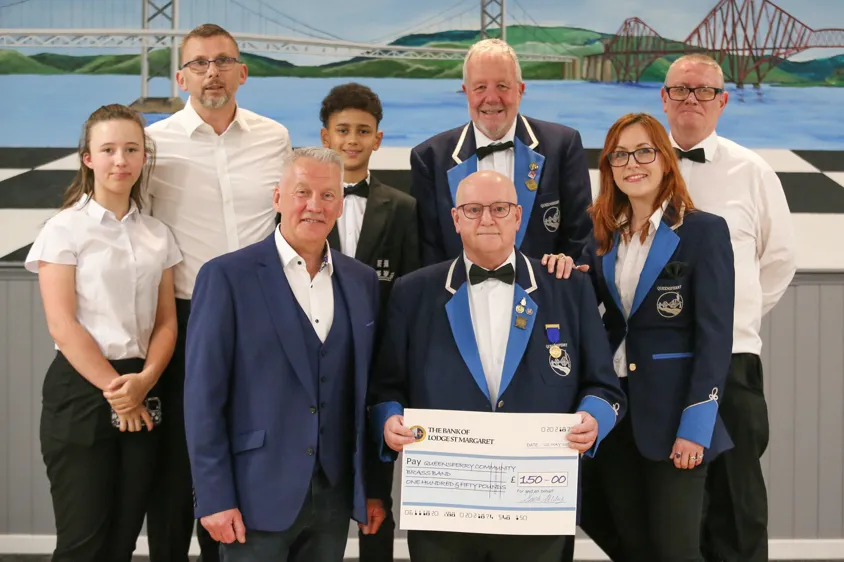 Image of master-with-members-of-Queensferrry-Community-Band